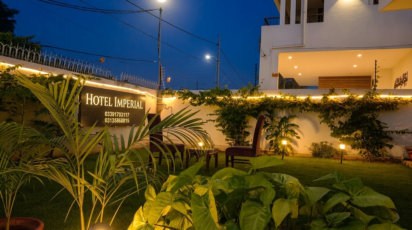 Hotel Imperial garden at night with warm ambient lighting